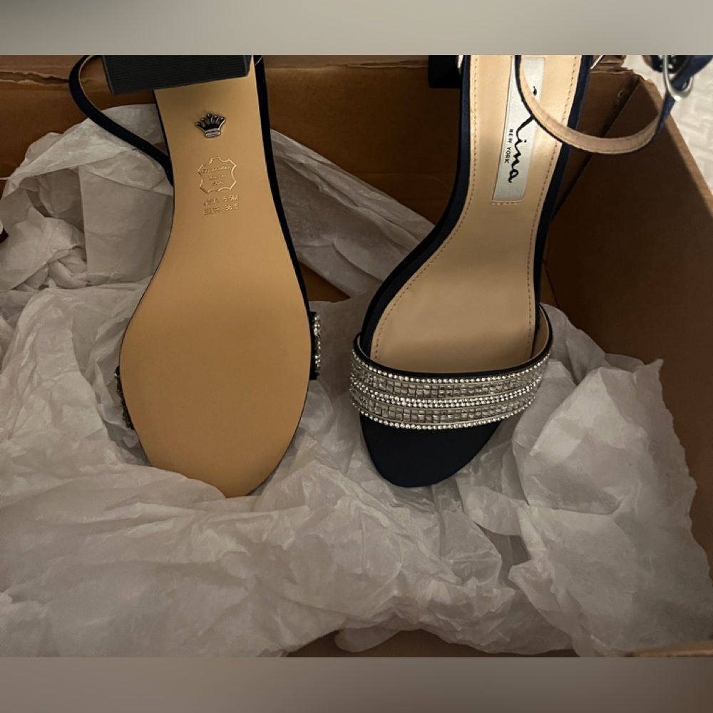 Woman’s dress shoes, navy and silver. Size 6.5M.  Nina brand.  Never worn.